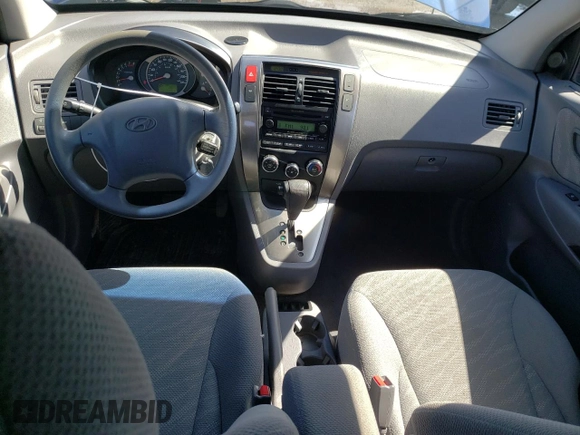 2005 Hyundai Tucson GL with VIN KM8JM72D55U167063, listed as a Copart auction lot 52002865 with 157,945 mi miles and Salvage Title. Bid and sale history available at carsss.com. Image 8.