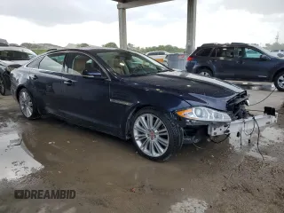 2015 Jaguar XJ Portfolio with VIN SAJWJ2GD2F8V90287, listed as a Copart auction lot 50291095 with 46,917 mi miles and Salvage title. Bid and sale history available at DreamBid. Image 4.