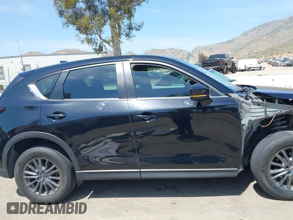2019 Mazda CX-5 Sport with VIN JM3KFABM7K1509987, listed as a IAAI auction lot 42062804 with 50,898 mi miles and . Bid and sale history available at DreamBid. Image 14.