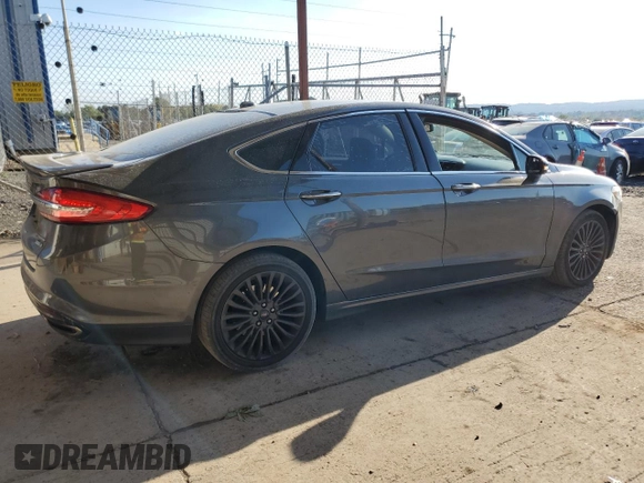 2018 Ford Fusion Titanium с VIN 3FA6P0D92JR192382, выставлен на аукционе Copart как лот 74065774 с пробегом 110 411 миль миль и Списание • Salvage title. История ставок и продаж доступна на DreamBid. Изображение 3.