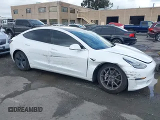 2020 Tesla Model 3 Long Range with VIN 5YJ3E1EB6LF619528, listed as a IAAI auction lot 41937430 with 70,327 mi miles. Bid and sale history available at carsss.com. Image 6.