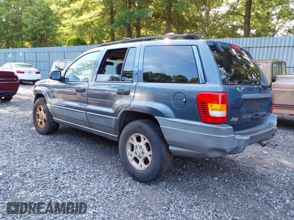 2001 Jeep Grand Cherokee Laredo with VIN 1J4GW48SX1C585867, listed as a IAAI auction lot 42793657 with 197,167 mi miles and . Bid and sale history available at DreamBid. Image 3.