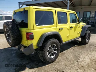 2024 Jeep Wrangler Rubicon z VIN 1C4RJXR64RW193946, wystawiony jako Copart lot #51693105 z przebiegiem 4 863 mil mil oraz Szkoda całkowita • Salvage title. Historia ofert i sprzedaży dostępna na DreamBid. Obrazek 3.