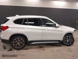 2021 BMW X1 xDrive28i with VIN WBXJG9C0XM5T76975, listed as a IAAI auction lot 41310115 with 26,869 mi miles. Bid and sale history available at carsss.com. Image 14.