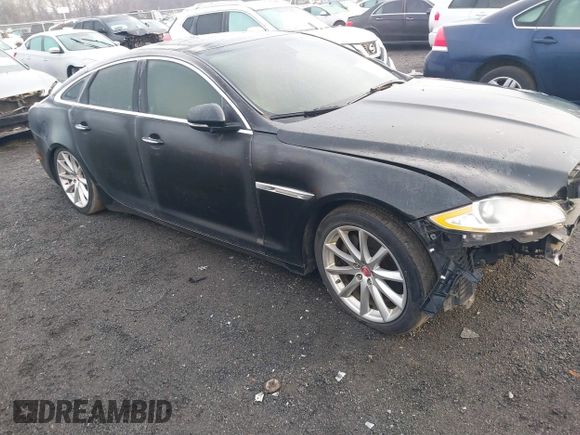 2014 Jaguar XJ with VIN SAJWA1CZXE8V74400, listed as a IAAI auction lot 38250698 with 102,205 mi miles and . Bid and sale history available at DreamBid. Image 1.