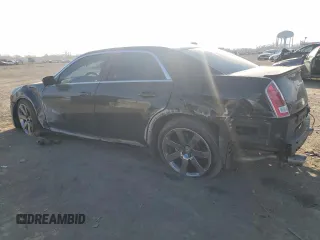 2013 Chrysler 300 SRT-8 with VIN 2C3CCAFJ8DH646483, listed as a Copart auction lot 83261144 with 86,015 mi miles and Salvage Title. Bid and sale history available at DreamBid. Image 2.