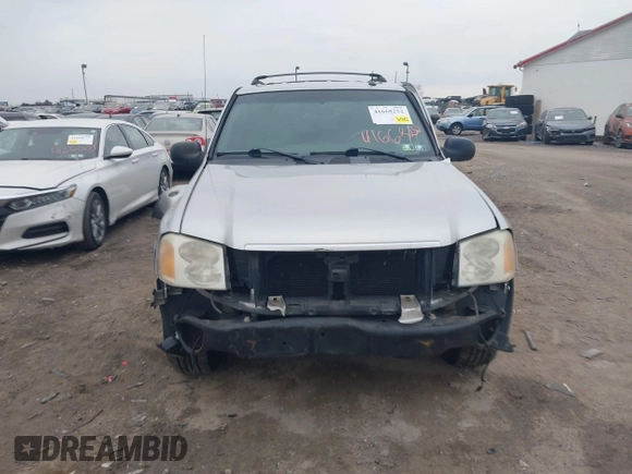 2004 GMC Envoy SLE with VIN 1GKDT13SX42135951, listed as a IAAI auction lot 41668252 with 216,193 mi miles. Bid and sale history available at carsss.com. Image 13.