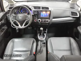 2015 Honda Fit EX-L z VIN 3HGGK5H89FM756045, wystawiony jako Copart lot #60536925 z przebiegiem 64 997 mil mil oraz Czysty tytuł • Clean title. Historia ofert i sprzedaży dostępna na DreamBid. Obrazek 8.