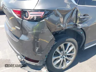 2018 Mazda CX-5 Grand Touring with VIN JM3KFADM8J1310328, listed as a IAAI auction lot 42322780 with 106,378 mi miles and . Bid and sale history available at DreamBid. Image 6.