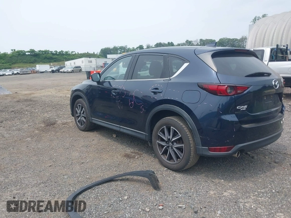 2018 Mazda CX-5 Grand Touring with VIN JM3KFBDMXJ0361812, listed as a IAAI auction lot 42509752 with 131,386 mi miles and . Bid and sale history available at DreamBid. Image 3.