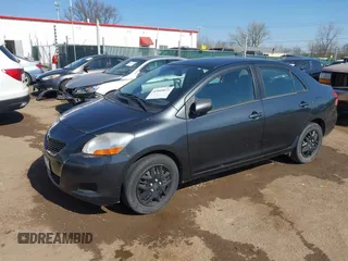 2009 Toyota Yaris with VIN JTDBT903194047784, listed as a IAAI auction lot 42049872 with 115,735 mi miles. Bid and sale history available at carsss.com. Image 2.