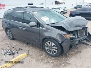 2015 Honda Odyssey Touring Elite with VIN 5FNRL5H99FB089642, listed as a IAAI auction lot 42591786 with 100,755 mi miles and . Bid and sale history available at DreamBid. Image 1.
