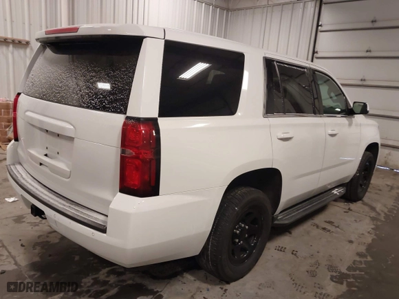 2018 Chevrolet Tahoe Commercial with VIN 1GNSKDEC1JR240868, listed as a IAAI auction lot 41608806 with 138,126 mi miles. Bid and sale history available at carsss.com. Image 4.