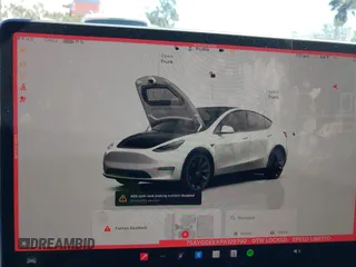 2023 Tesla Model Y Long Range with VIN 7SAYGDEEXPA129790, listed as a IAAI auction lot 41735721 with 20,402 mi miles and . Bid and sale history available at DreamBid. Image 19.