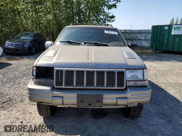 1998 Jeep Grand Cherokee Limited z VIN 1J4GZ88Z1WC231772, wystawiony jako Copart lot #55697775 z przebiegiem 178 896 mil mil oraz Czysty tytuł • Clean title. Historia ofert i sprzedaży dostępna na DreamBid. Obrazek 5.
