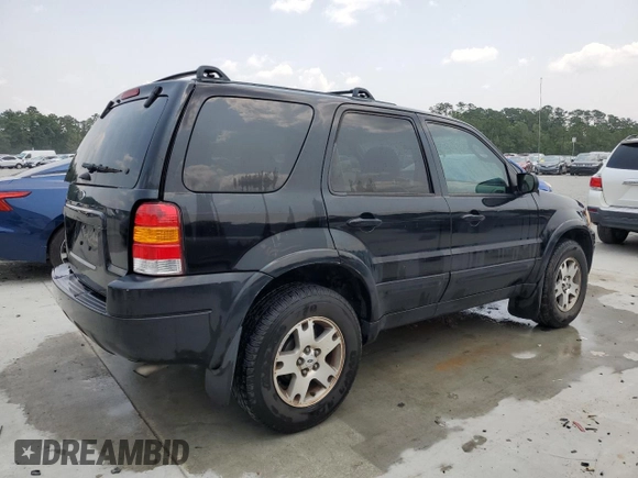 2004 Ford Escape Limited with VIN 1FMCU04164KB51256, listed as a Copart auction lot 58969565 with 137,360 mi miles and Salvage title. Bid and sale history available at DreamBid. Image 3.