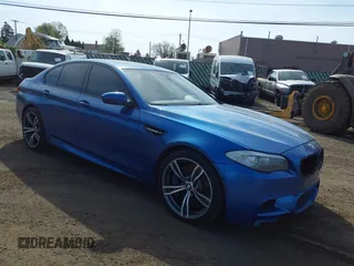 2013 BMW M5 with VIN WBSFV9C56DC774032, listed as a IAAI auction lot 42124754 with 55,409 mi miles. Bid and sale history available at carsss.com. Image 1.