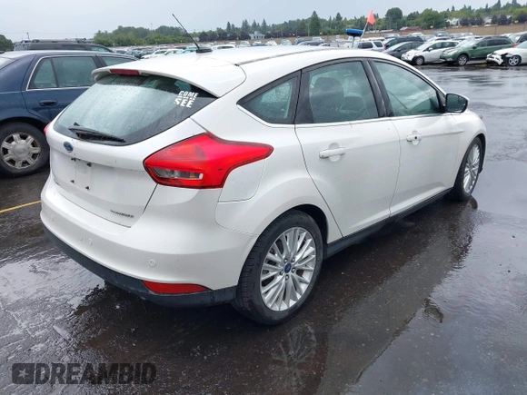 2015 Ford Focus Titanium z VIN 1FADP3N28FL262273, wystawiony jako IAAI lot #42552995 z przebiegiem 60 504 mil mil oraz . Historia ofert i sprzedaży dostępna na DreamBid. Obrazek 4.
