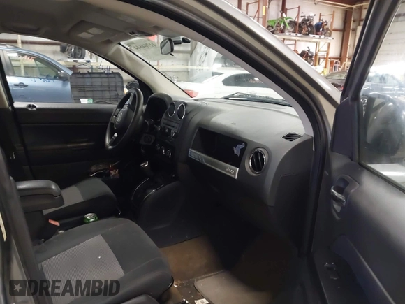 2014 Jeep Compass Sport with VIN 1C4NJDBB5ED567863, listed as a IAAI auction lot 41704644 with 163,405 mi miles. Bid and sale history available at carsss.com. Image 5.