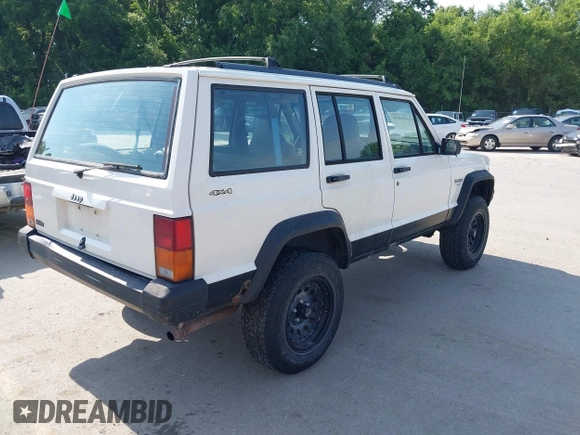 1996 Jeep Cherokee Sport z VIN 1J4FJ68S3TL226188, wystawiony jako IAAI lot #42460538 z przebiegiem 217 118 mil mil oraz . Historia ofert i sprzedaży dostępna na DreamBid. Obrazek 4.