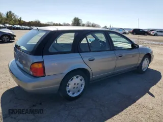 1997 Saturn SW z VIN 1G8ZK8274VZ194085, wystawiony jako Copart lot #50230135 z przebiegiem 211 051 mil mil oraz Szkody całkowita. Historia ofert i sprzedaży dostępna na DreamBid. Obrazek 3.