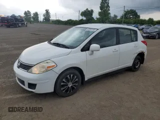 2009 Nissan Versa S with VIN 3N1BC13E09L488155, listed as a Copart auction lot 62944195 with 218,700 mi miles and Salvage title. Bid and sale history available at DreamBid. Image 1.