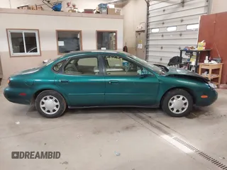 1996 Ford Taurus GL z VIN 1FALP52U5TG110582, wystawiony jako IAAI lot #40858639 z przebiegiem 57 965 mil mil oraz . Historia ofert i sprzedaży dostępna na DreamBid. Obrazek 13.