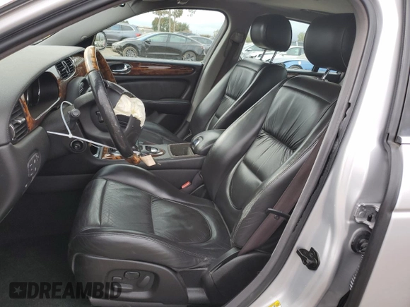 2004 Jaguar XJ with VIN SAJEA74C34SG09548, listed as a Copart auction lot 71754774 with 142,804 mi miles and Salvage Title. Bid and sale history available at DreamBid. Image 7.
