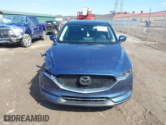 2021 Mazda CX-5 Touring with VIN JM3KFBCM4M0404093, listed as a IAAI auction lot 41751343 with 50,536 mi miles. Bid and sale history available at carsss.com. Image 12.