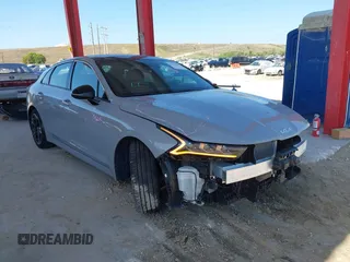 2023 Kia K5 GT-Line z VIN 5XXG64J24PG183772, wystawiony jako IAAI lot #42155447 z przebiegiem 25 313 mil mil oraz . Historia ofert i sprzedaży dostępna na DreamBid. Obrazek 1.