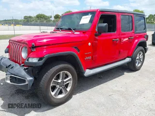 2019 Jeep Wrangler Unlimited Sahara with VIN 1C4HJXEG4KW573157, listed as a IAAI auction lot 42118373 with 105,890 mi miles and . Bid and sale history available at DreamBid. Image 17.