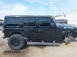 2020 Jeep Wrangler Unlimited Sahara with VIN 1C4HJXEG6LW211932, listed as a IAAI auction lot 42040546 with 74,732 mi miles and . Bid and sale history available at DreamBid. Image 14.