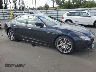 2015 Maserati Ghibli z VIN ZAM57XSA5F1129866, wystawiony jako Copart lot #51738015 z przebiegiem Nie podano mil oraz Szkoda całkowita • Salvage title. Historia ofert i sprzedaży dostępna na DreamBid. Obrazek 4.