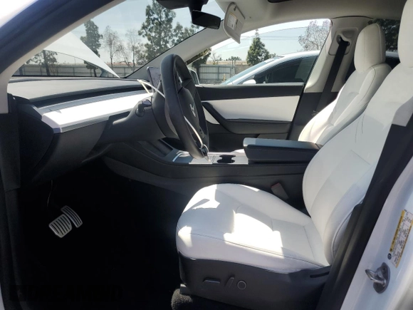 2022 Tesla Model Y Performance with VIN 7SAYGDEFXNF407340, listed as a Copart auction lot 54376895 with 56,709 mi miles and Salvage Title. Bid and sale history available at DreamBid. Image 7.