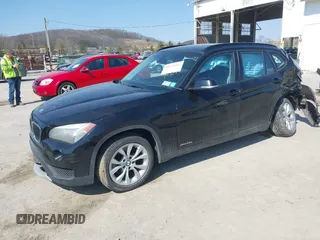 2013 BMW X1 xDrive28i with VIN WBAVL1C59DVR87469, listed as a IAAI auction lot 41775333 with 124,220 mi miles. Bid and sale history available at carsss.com. Image 2.