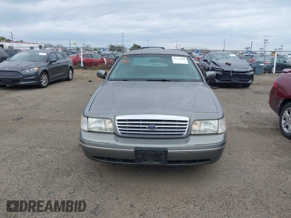 1999 Ford Crown Victoria LX z VIN 2FAFP74W4XX192490, wystawiony jako IAAI lot #41791909 z przebiegiem 115 469 mil mil oraz . Historia ofert i sprzedaży dostępna na DreamBid. Obrazek 6.