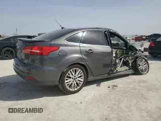 2016 Ford Focus Titanium with VIN 1FADP3J20GL274263, listed as a Copart auction lot 48340175 with 114,941 mi miles and Salvage title. Bid and sale history available at DreamBid. Image 3.