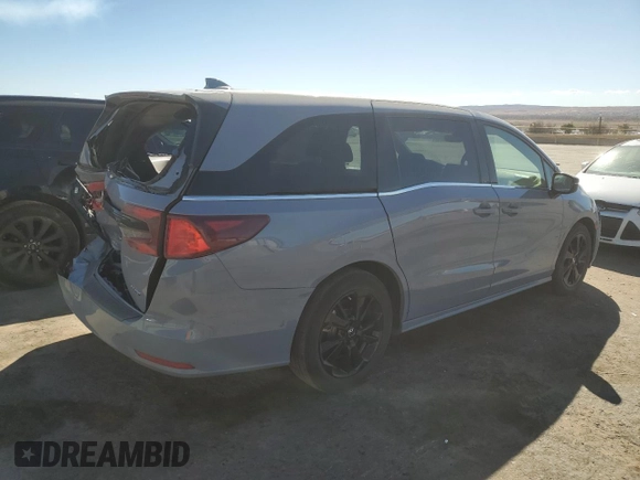 2023 Honda Odyssey Sport with VIN 5FNRL6H77PB052532, listed as a Copart auction lot 50596275 with 23,457 mi miles and Salvage Title. Bid and sale history available at carsss.com. Image 3.