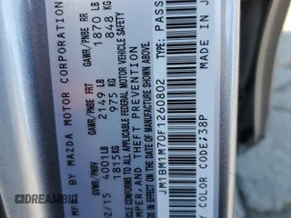 2015 Mazda 3 i Grand Touring z VIN JM1BM1M70F1260802, wystawiony jako Copart lot #60662705 z przebiegiem 89 974 mil mil oraz Szkoda całkowita • Salvage title. Historia ofert i sprzedaży dostępna na DreamBid. Obrazek 12.