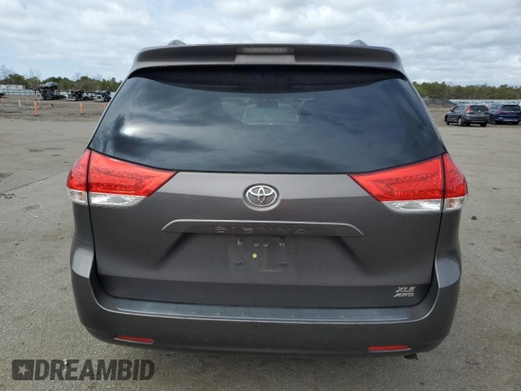 2012 Toyota Sienna XLE with VIN 5TDDK3DC2CS038316, listed as a Copart auction lot 52694245 with 273,415 mi miles and Clean Title. Bid and sale history available at DreamBid. Image 6.