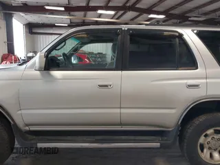 1999 Toyota 4Runner SR5 z VIN JT3HN86R8X0221532, wystawiony jako IAAI lot #41902556 z przebiegiem 406 602 mil mil oraz . Historia ofert i sprzedaży dostępna na DreamBid. Obrazek 15.