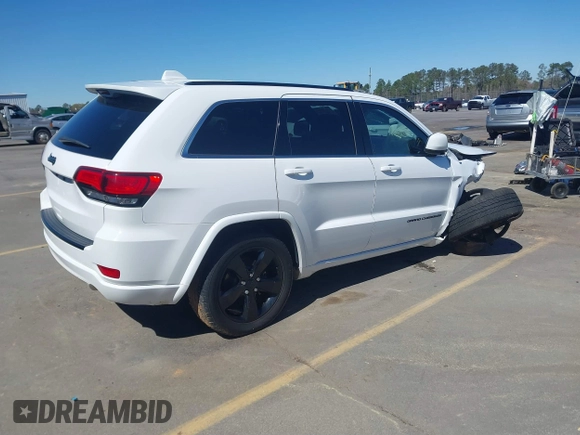 2015 Jeep Grand Cherokee Altitude with VIN 1C4RJEAG4FC815743, listed as a IAAI auction lot 41815095 with 106,867 mi miles. Bid and sale history available at carsss.com. Image 4.