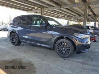 2020 BMW X5 xDrive40i with VIN 5UXCR6C02L9C72472, listed as a Copart auction lot 48023145 with 59,200 mi miles and Salvage title. Bid and sale history available at DreamBid. Image 4.