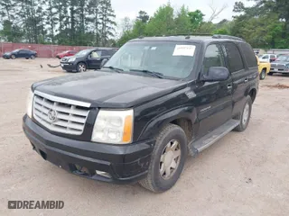 2005 Cadillac Escalade with VIN 1GYEC63TX5R203156, listed as a IAAI auction lot 41937137 with 239,919 mi miles. Bid and sale history available at carsss.com. Image 2.