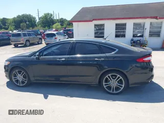 2014 Ford Fusion Titanium with VIN 3FA6P0K9XER216551, listed as a IAAI auction lot 42037004 with 113,857 mi miles and . Bid and sale history available at DreamBid. Image 14.