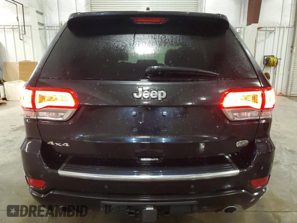 2015 Jeep Grand Cherokee Overland with VIN 1C4RJFCG7FC911899, listed as a Copart auction lot 54123925 with 243,031 mi miles and Salvage Title. Bid and sale history available at carsss.com. Image 6.