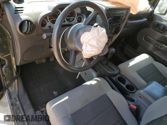 2010 Jeep Wrangler Rubicon with VIN 1J4BA6D12AL221220, listed as a Copart auction lot 56057055 with 200,346 mi miles and Salvage title. Bid and sale history available at DreamBid. Image 8.