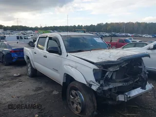 2014 Toyota Tacoma PreRunner with VIN 3TMJU4GN3EM162405, listed as a IAAI auction lot 40807077 with 103,298 mi miles. Bid and sale history available at carsss.com. Image 1.
