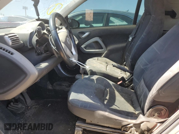 2010 Smart fortwo Pure с VIN WMEEJ3BA1AK360041, выставлен на аукционе Copart как лот 59594055 с пробегом Не указан миль и Списание • Salvage title. История ставок и продаж доступна на DreamBid. Изображение 7.