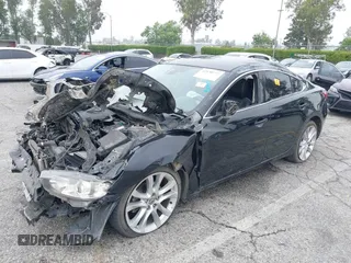 2014 Mazda 6 i Touring with VIN JM1GJ1T6XE1162480, listed as a IAAI auction lot 42150777 with 148,113 mi miles and . Bid and sale history available at DreamBid. Image 2.